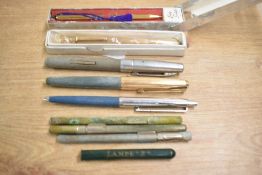 A box of fountain pens, ballpoint pens and pencils. Includes a Parker 61 Custom converter fill pen