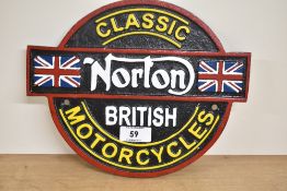 A painted Classic Norton British Motorcycles cast wall plaque