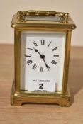 A late 19th to early 20th-century French brass 5 glass carriage clock, featuring glass panels and
