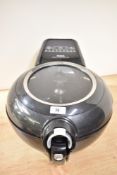 A Tefal Actify Genius XL airfryer with paddle in working order.