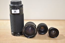 A camera case with a Mikinon 1:4-5,6 35-300mm lens, a Vivitar 28mm 1:2,5 Auto Wide angle lens, a