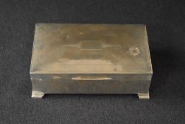 A George V silver cigarette box of hinged rectangular form having engine turned decoration to lid,