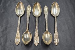 A cased group of five Victorian silver teaspoons, having scroll decoration to the handles, marks for