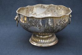 A 20th century silver plated punch bowl, having a lobed gadrooned rim, floral decoration and a