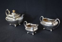 A Victorian silver three piece tea set comprising tea, sugar and cream of traditional form having