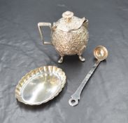 An Elizabeth II silver pin dish of oval form having a crimped rim sold alongside a white metal cream