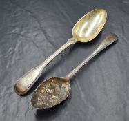 A George III silver berry spoon, of traditional form having decorative engraving and vacant