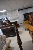 A reproduction mahogany torchere style jardiniere stand with ceramic jardiniere attached,overall