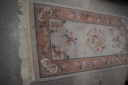 A traditional Chinese fireside rug, approx. 160 x 77cm