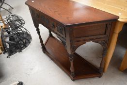A modern oak old charm or priory style hall table with card frieze drawer, max width approx. 107,