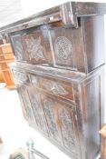 A period oak court cupboard of typical design with foliate carving throughout, dimensions approx.