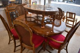 A vintage Continental style extending dining table and set of six (four plus two dining chairs),