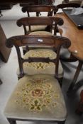A set of four Victorian mahogany railback dining chairs having upholstered foliate seats