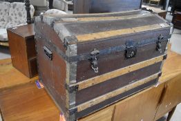 A vintage dome top travel trunk, approx width. 75cm, some signs of historical worm