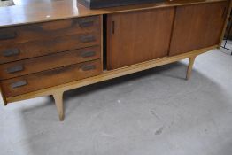 A vintage (mid Century) teak sideboard in the Scandinavian style, comprising four drawers , and