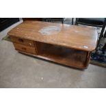 A vintage Ercol 'Pandora' style coffee table, badly stained and in need of restoration, though sound
