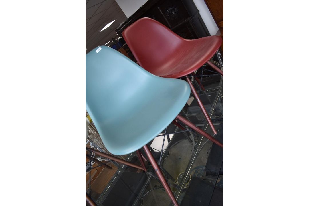 A pair of modern designer chairs, by Vitra after Eames, having dark maple legs, in ocean and oxide - Image 1 of 3