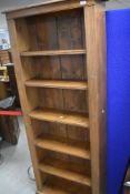 A modern pine tall bookshelf, dimensions approx. Height 190, width 77, depth 26cm