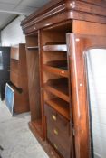 A Victorian mahogany double wardrobe with hanging rail section and linen drawer section,