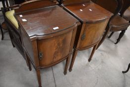 A pair of Edwardian mahogany bedside cabinets having ledge backs and pull out slides (in need of