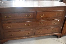 A period oak mule chest having lift lid over two faux drawers, one long drawer and three lower