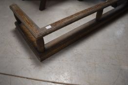 An early 20th Century oak fire fender, internal dimensions approx. 140 x 31cm