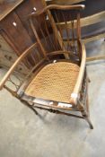 A late Victorian mahogany framed carver chairs having twist canework back and sides and