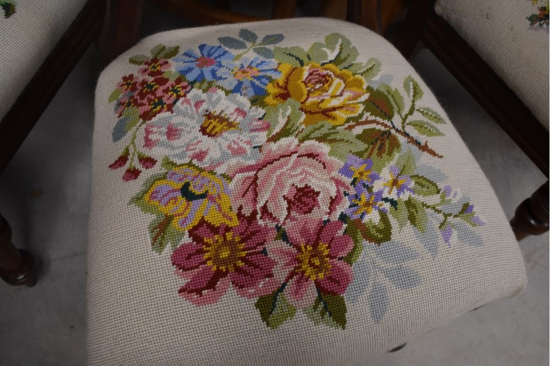 A set of four Victorian mahogany balloon back dining chairs having later tapestry foliate decoration - Image 4 of 4