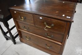 An early 20th Century mahogany chest of two short over two long drawers, significant wear to top but