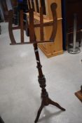 A modern mahogany music stand, height approx. 125cm