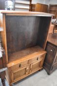 An early 20th Century oak bookshelf having two drawer and cupboard under, dimensions approx.