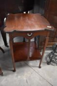 A late Victorian mahogany occasional table having shaped top , with Art Nouveau or Arts and Crafts