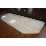 An Onyx sidetable or cabinet top having canted front, width approx. 83cm