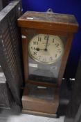 An early 20th Century oak cased time recorder clock, dial named for National electric, sold with