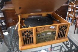 A modern music centre modelled as gramophone, labelled Prolectrix, model SB513774, with record and