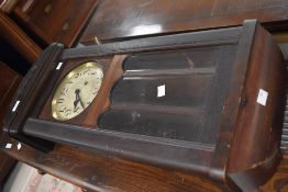 An early 20th Century stained frame wall clock having arabic numerals to silvered dial, height