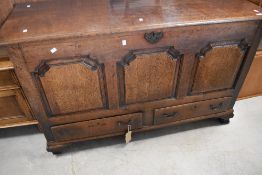 A Georgian oak coffer having three panel front and drawers to base, on bracket feet, dimensions