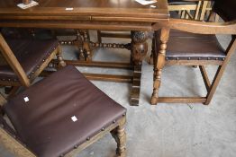 An early to mid 20th Century oak drawer leaf dining table and set of six (four plus two) dining