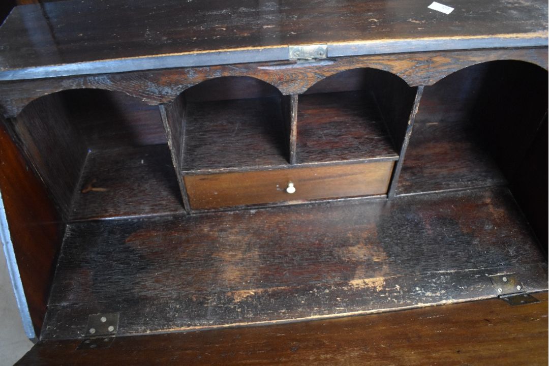 An Edwardian mahogany bureau of small proportions having typical drop flap over three long drawers - Image 2 of 2