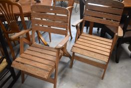 A pair of folding wooden garden chairs