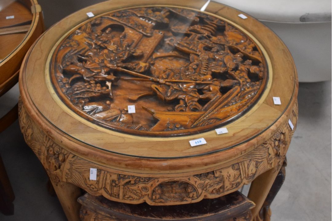 An Oriental coffee table , having four smaller nesting tables under, faded to edges and wear to - Image 1 of 2