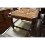 A traditional strung footstool