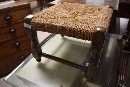 A traditional strung footstool