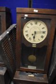 An early 20th Century oak cased time recorder clock, dial named for Gledhill-Brook, sold with