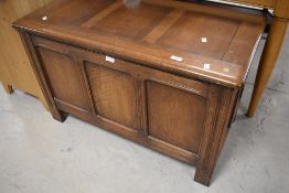 A mid to late 20th Century oak bedding box having three panels to front, dimensions approx. 96 x