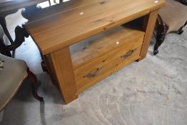 A modern golden oak TV cabinet , width approx. 97cm
