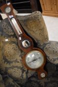 A 19th Century mahogany cased onion barometer having silvered dial, with thermometer scale and