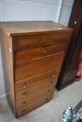 An early to mid 20th Century oak bureau/drawers, having lift lid (hinge loose) drop flap desk