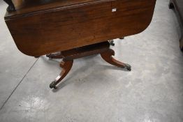 A 19th Century mahogany pedestal table in the Pembroke style , with William IV style platform base