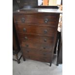 An early 20th Century oak bedroom chest of six long drawers, having Art Deco style drop handles,